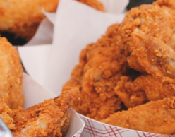 Paper plates of fried chicken